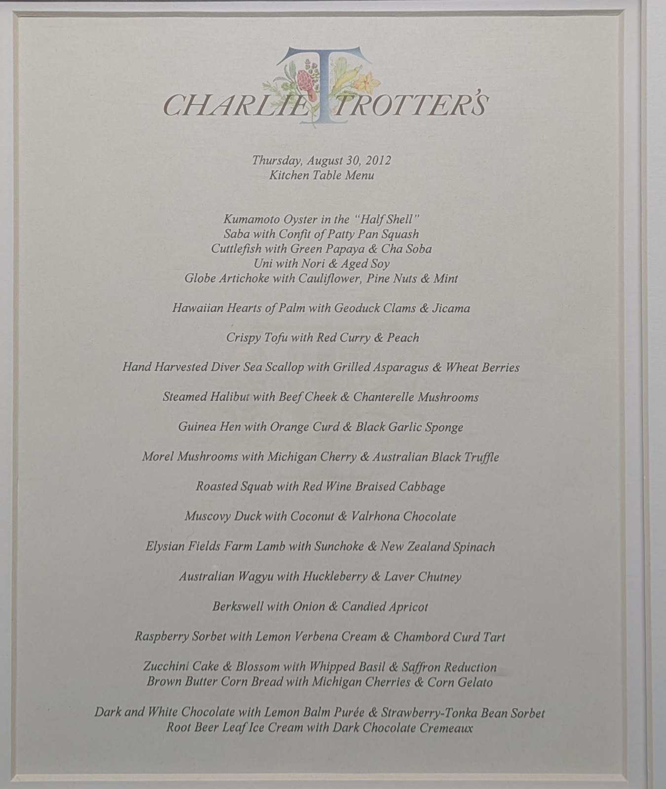 The framed menu from Charlie Trotter's, Thursday, August 30, 2012, headed Kitchen Table Menu: eighteen courses from Kumamoto oyster to root beer leaf ice cream.